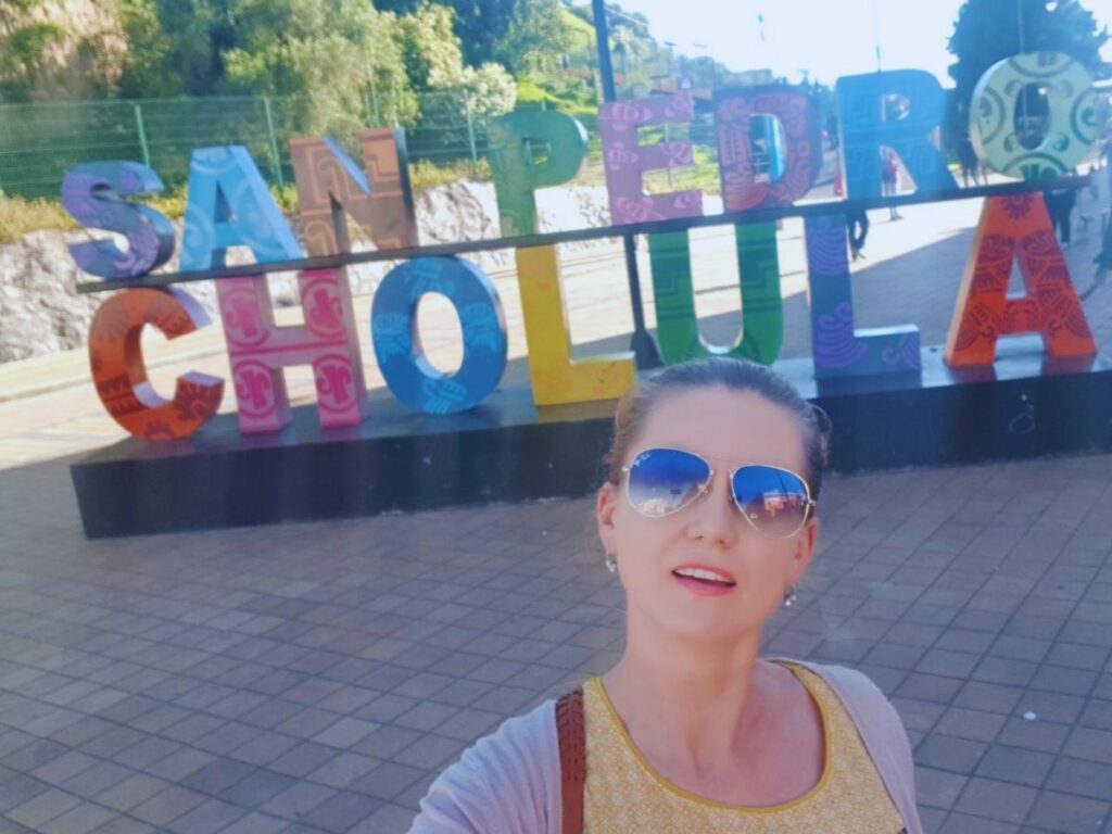 Selfie in front of Cholula Colorful Sign