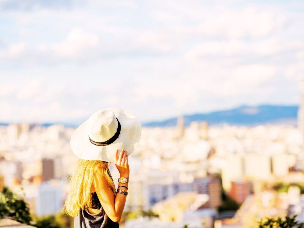 lady in Barcelona seeing the city from the luxury hotel balcony, Barcelona Spain