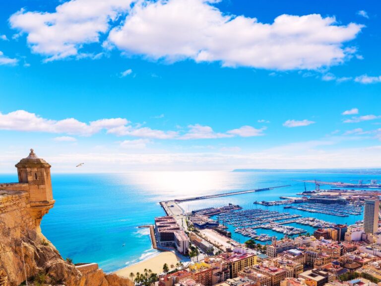 view from the mountain to the beach, marina and hotels in Alicante, Spain