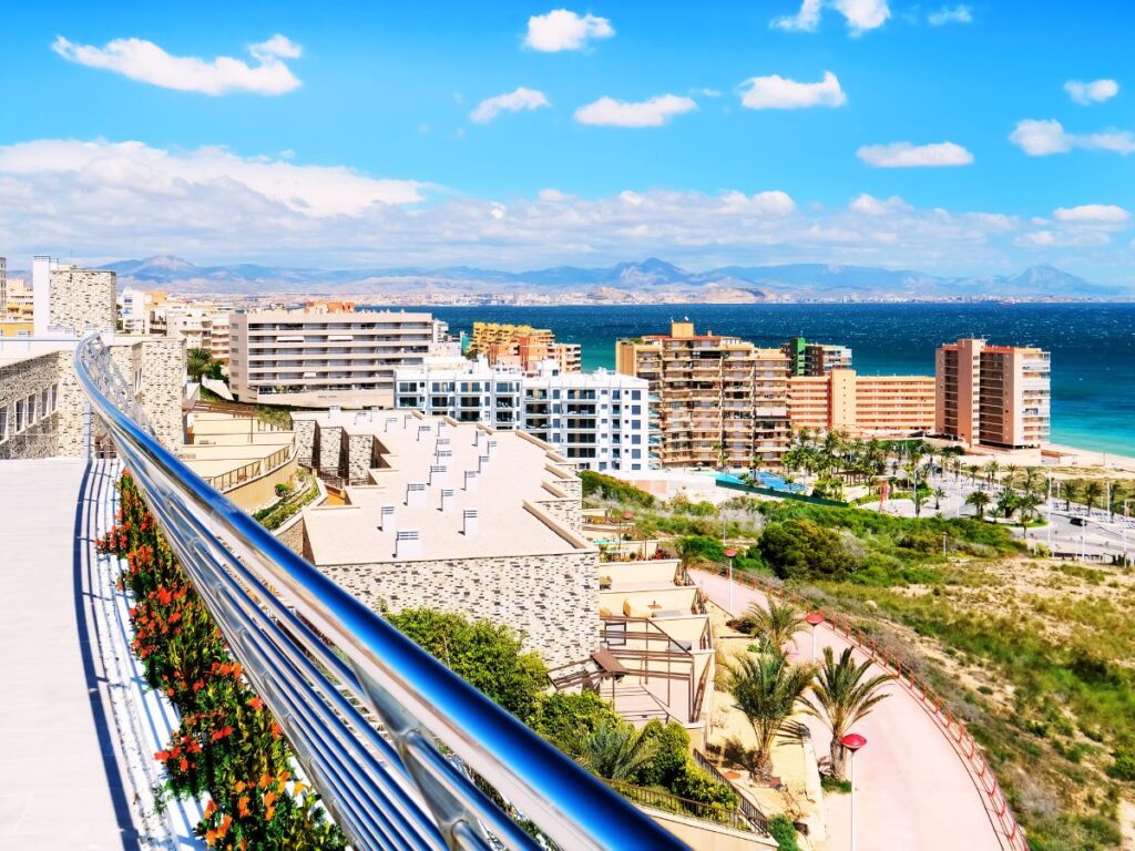 View from the hotel balcony over Alicante towns, sea and beach, Spain