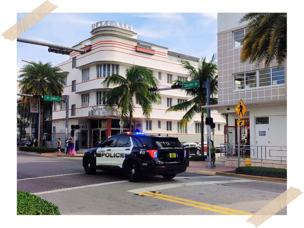 police car rounding Miami streets