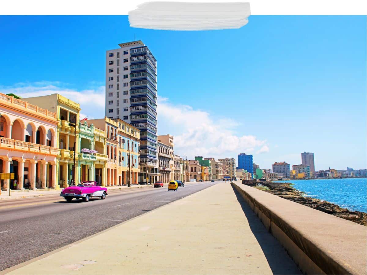 Coastal road with epoque cars in Havana